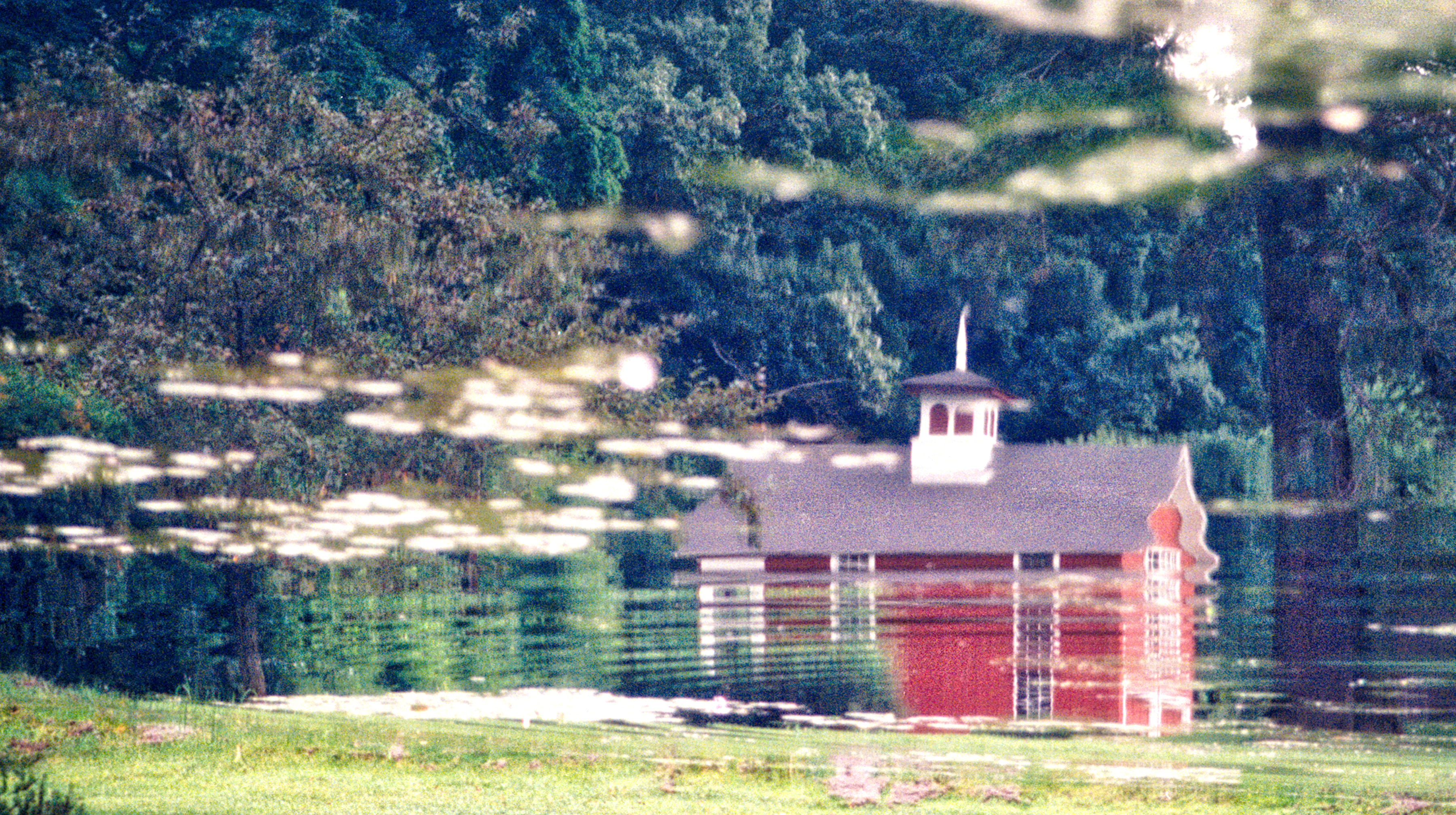 reflection of a schoolhouse in water