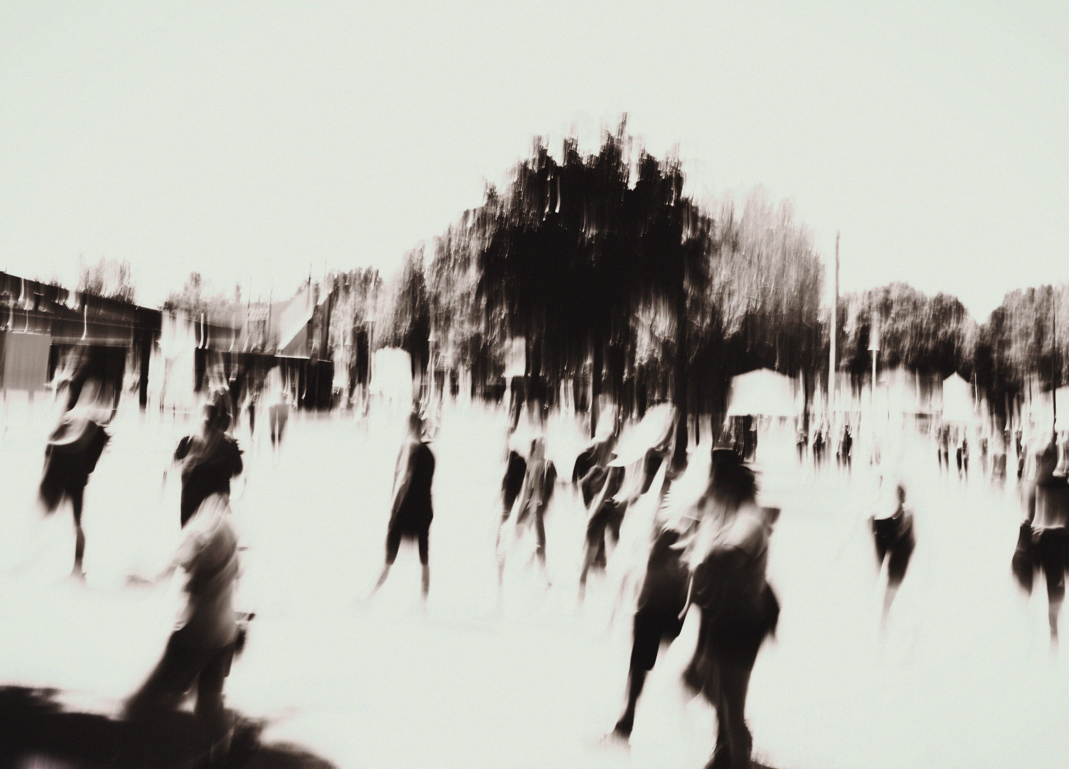 black and white photograph of a crowd in motion