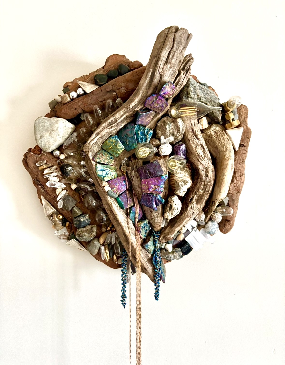 physical collage of driftwood and seaglass