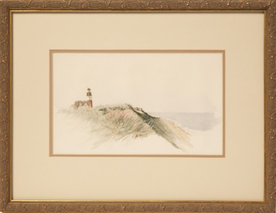 framed painting of a lighthouse on a beach