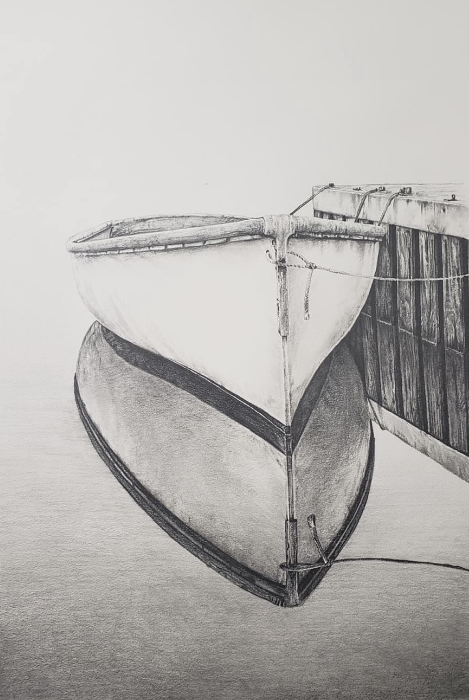 pencil drawing of a rowboat tied to a dock